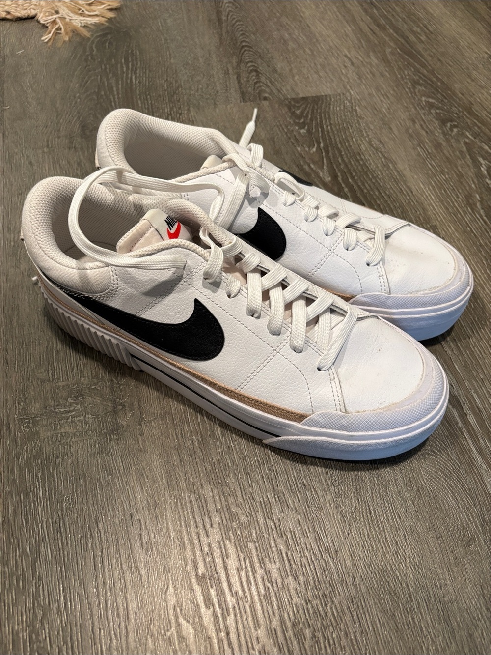 Nike Women’s White Sneakers with Black Swoosh and Tan Trim